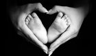 babys feet in motherss hands